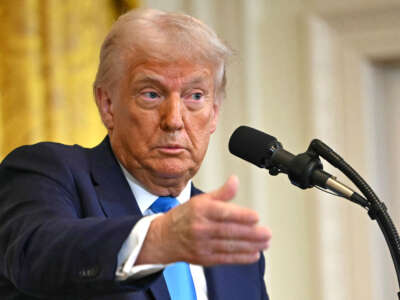 President Donald Trump speaks during a press conference with unseen Israel's Prime Minister Benjamin Netanyahu in the East Room of the White House in Washington, D.C., on February 4, 2025.