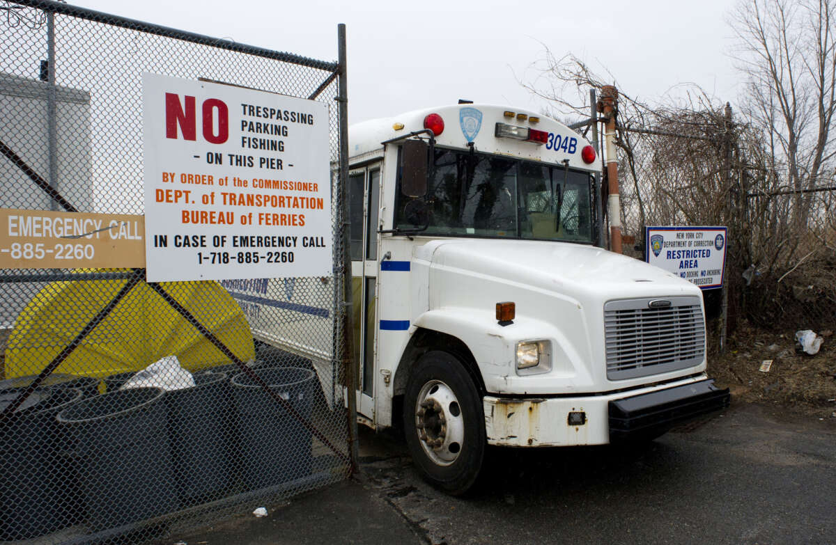 A New York City Department of Corrections bus leaves the City Island Ferry Station on March 28, 2014, in New York.