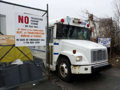 A New York City Department of Corrections bus leaves the City Island Ferry Station on March 28, 2014, in New York.