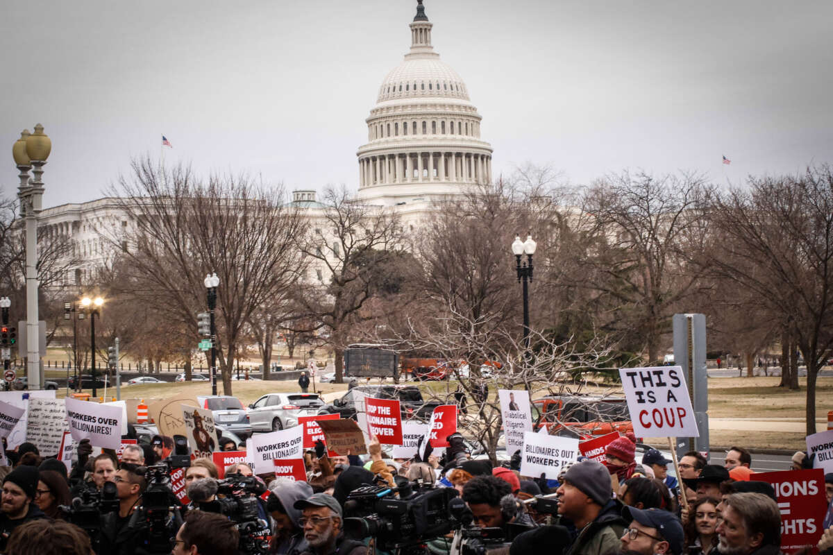 Protesters rally against the Department of Government Efficiency (DOGE) outside the U.S. Department of Labor on February 5, 2025, in Washington, D.C.