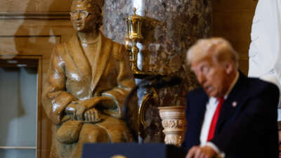 A statue of civil rights organizer Rosa Parks is seen behind President Donald Trump as he speaks during the National Prayer Breakfast at the U.S. Capitol in Washington, D.C., on February 6, 2025.