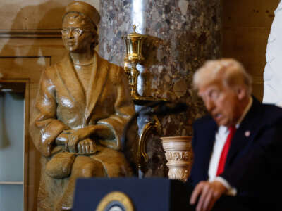 A statue of civil rights organizer Rosa Parks is seen behind President Donald Trump as he speaks during the National Prayer Breakfast at the U.S. Capitol in Washington, D.C., on February 6, 2025.