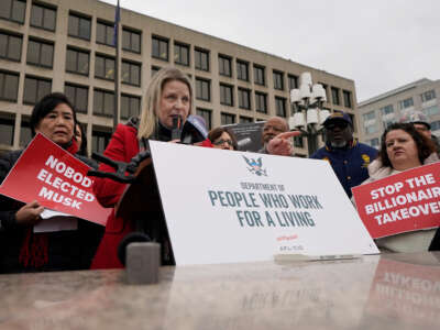 President of the AFL-CIO Liz Shuler speaks at a rally against the Department of Government Efficiency (DOGE) in front of the U.S. Department of Labor on February 5, 2025, in Washington, D.C.