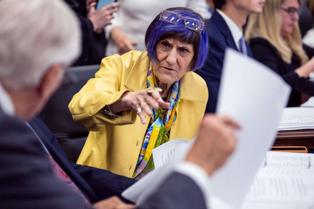 Rosa DeLauro speaks to someone at a hearing