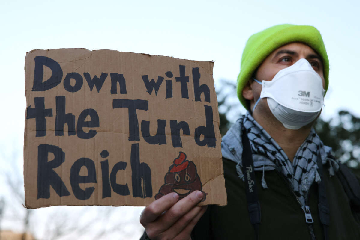 Demonstrators gather outside of the Office of Personnel Management to protest federal layoffs and demand the termination of Elon Musk and his proposed "Department of Government Efficiency," in Washington, D.C., on February 7, 2025.