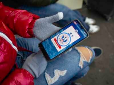 An immigrant from Venezuela tries in vain to access the CBP One app a day after the second inauguration of U.S. President Donald Trump on January 21, 2025, in Nogales, Mexico.