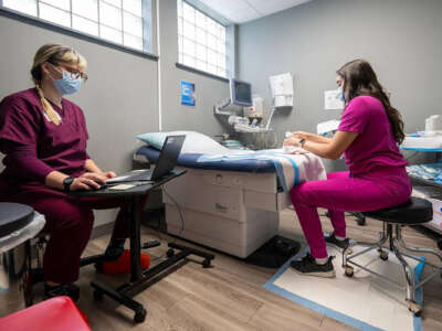 A registered nurse and an associate medical director prepare to provide a procedural abortion for a patient on February 15, 2025, at Planned Parenthood Great Plains in Kansas City, Missouri. It was the first procedural abortion in Kansas City in about 15 years.