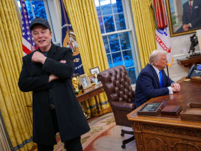 Tesla and SpaceX CEO Elon Musk and President Donald Trump appear during an executive order signing in the Oval Office at the White House on February 11, 2025, in Washington, D.C.