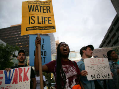 Protesters march during the MTV Video and Music Awards to bring attention to the water crisis gripping the city, outside the Prudential Center in Newark, New Jersey, on August 26, 2019.