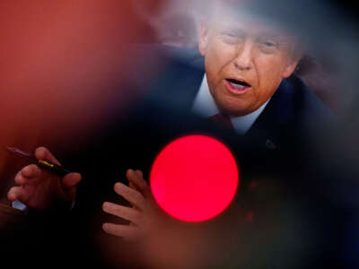 President Donald Trump speaks as he signs a series of executive orders in the Oval Office at the White House on February 10, 2025, in Washington, D.C.