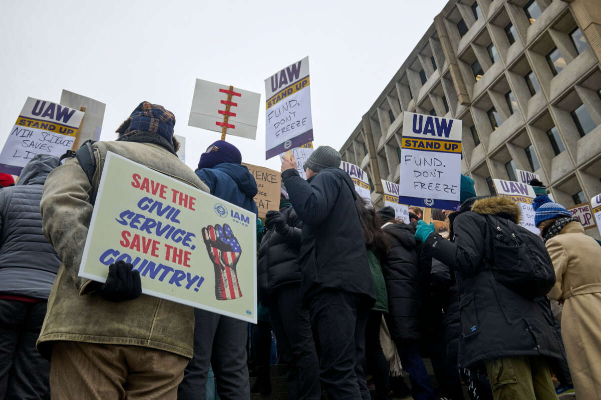 Former federal workers protest against Trump administration policies in front of the Hubert Humphrey Health and Human Services building in Washington D.C. on, February 19, 2025.