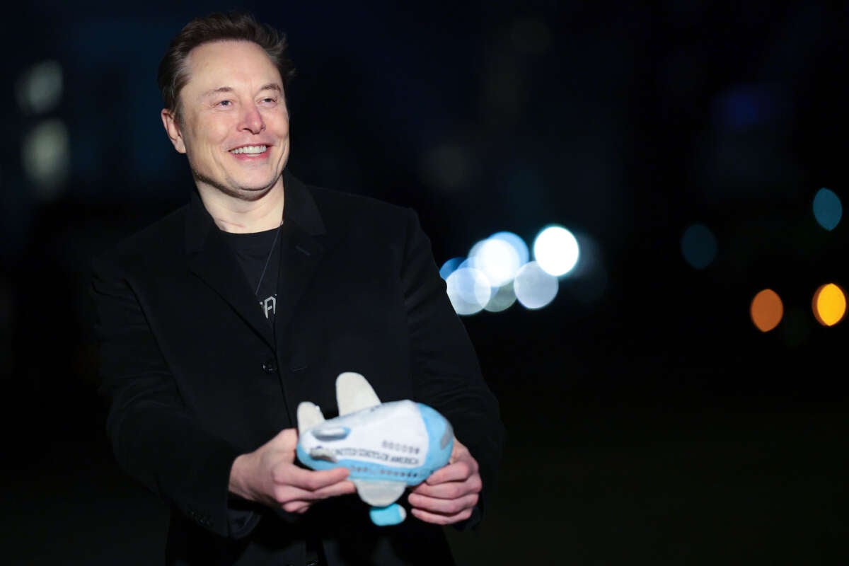 Tesla and SpaceX CEO Elon Musk holds up an Air Force One stuffed toy as he walks from the presidential helicopter Marine One on the South Lawn of the White House on February 19, 2025, in Washington, D.C.