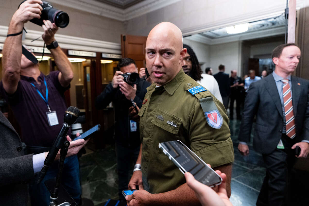 Rep. Brian Mast arrives for the House Republicans' caucus meeting for a members only discussion on electing a new speaker of the House in the Longworth House Office Building on October 13, 2023.