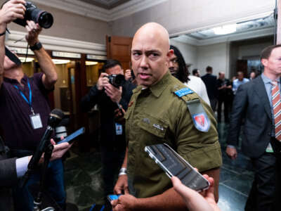 Rep. Brian Mast arrives for the House Republicans' caucus meeting for a members only discussion on electing a new speaker of the House in the Longworth House Office Building on October 13, 2023.