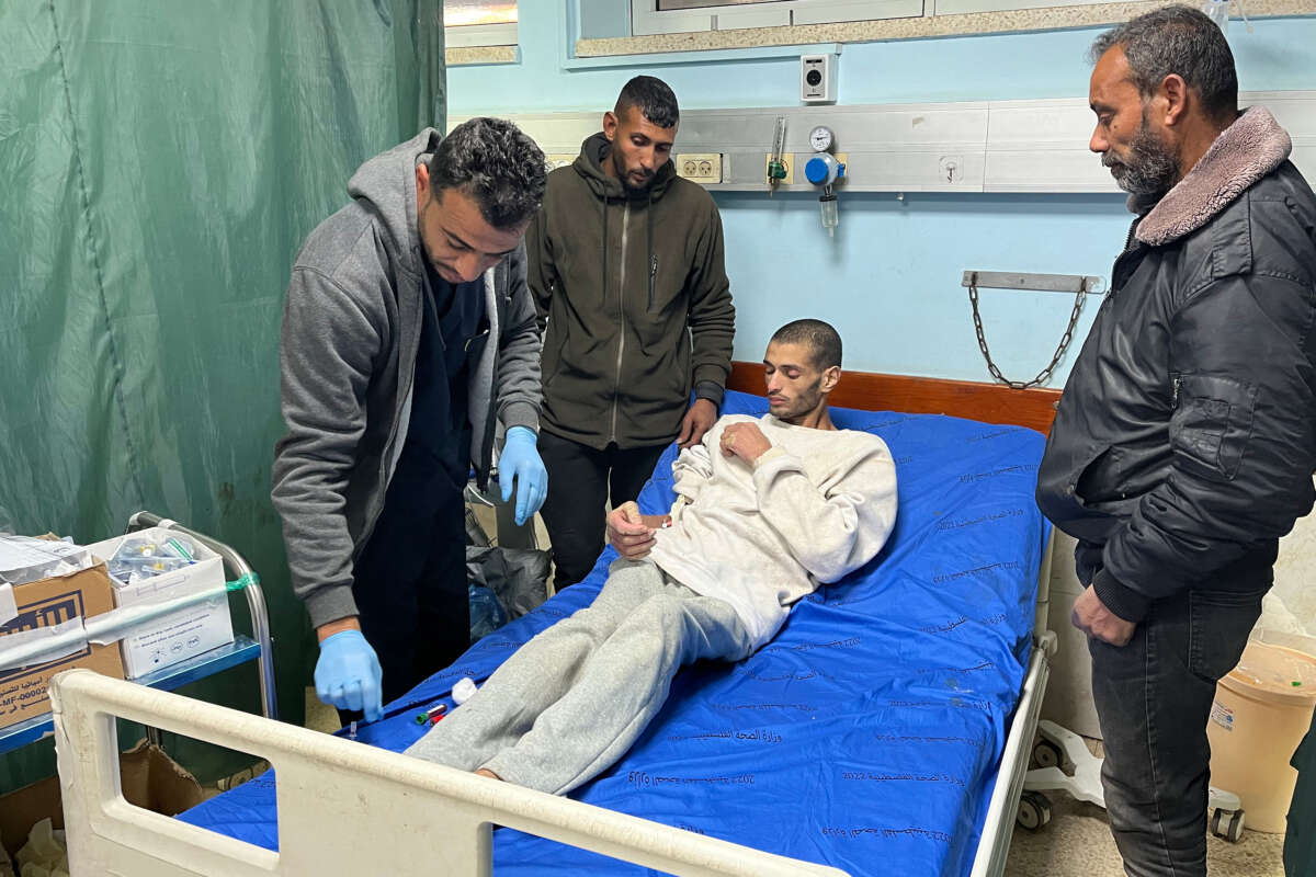 A Palestinian prisoner speaks with doctors at the European Hospital in Khan Yunis in the southern Gaza Strip early on February 27, 2025, following his release by Israeli authorities.