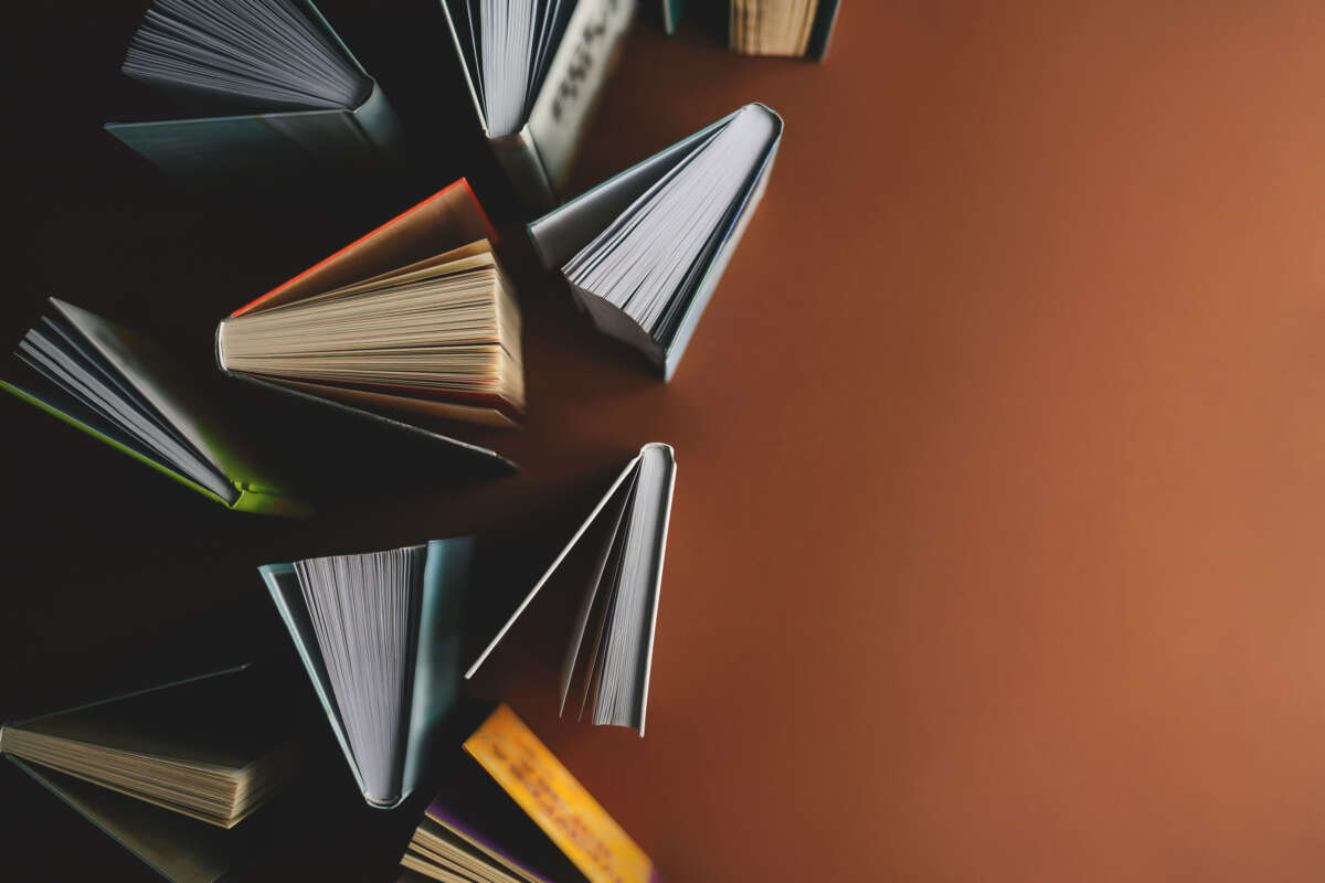 Books standing on brown background