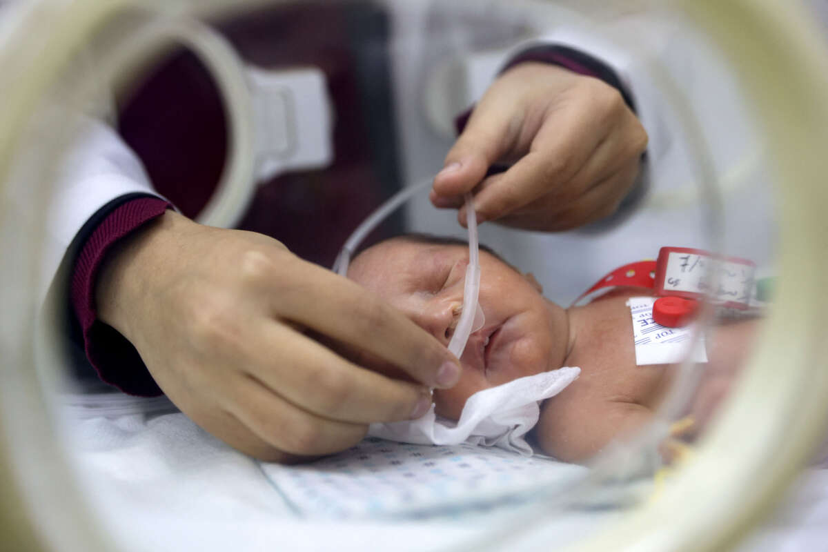 A prematurely-born infant receives care while lying in an incubator at the neonatal intensive care unit at the Patient Friend's Benevolent Society hospital in Gaza City on February 25, 2025, amid the ongoing truce in the war between Israel and Hamas in the Palestinian territory.