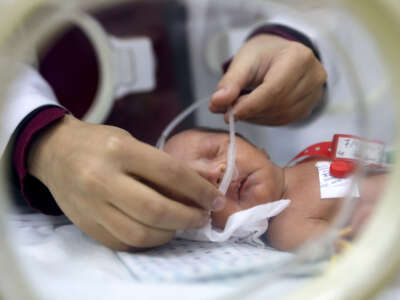 A prematurely-born infant receives care while lying in an incubator at the neonatal intensive care unit at the Patient Friend's Benevolent Society hospital in Gaza City on February 25, 2025, amid the ongoing truce in the war between Israel and Hamas in the Palestinian territory.