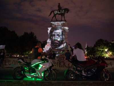 An image of Frederick Douglass is projected onto the Robert E. Lee Statue on Monument Avenue in Richmond, Virginia, on June 18, 2020.