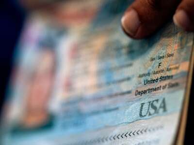 A person shows the Female gender marker on their current US passport, prior to beginning the process of filling out a passport application with an X gender marker, at their home in Alexandria, Virginia, on April 11, 2022.