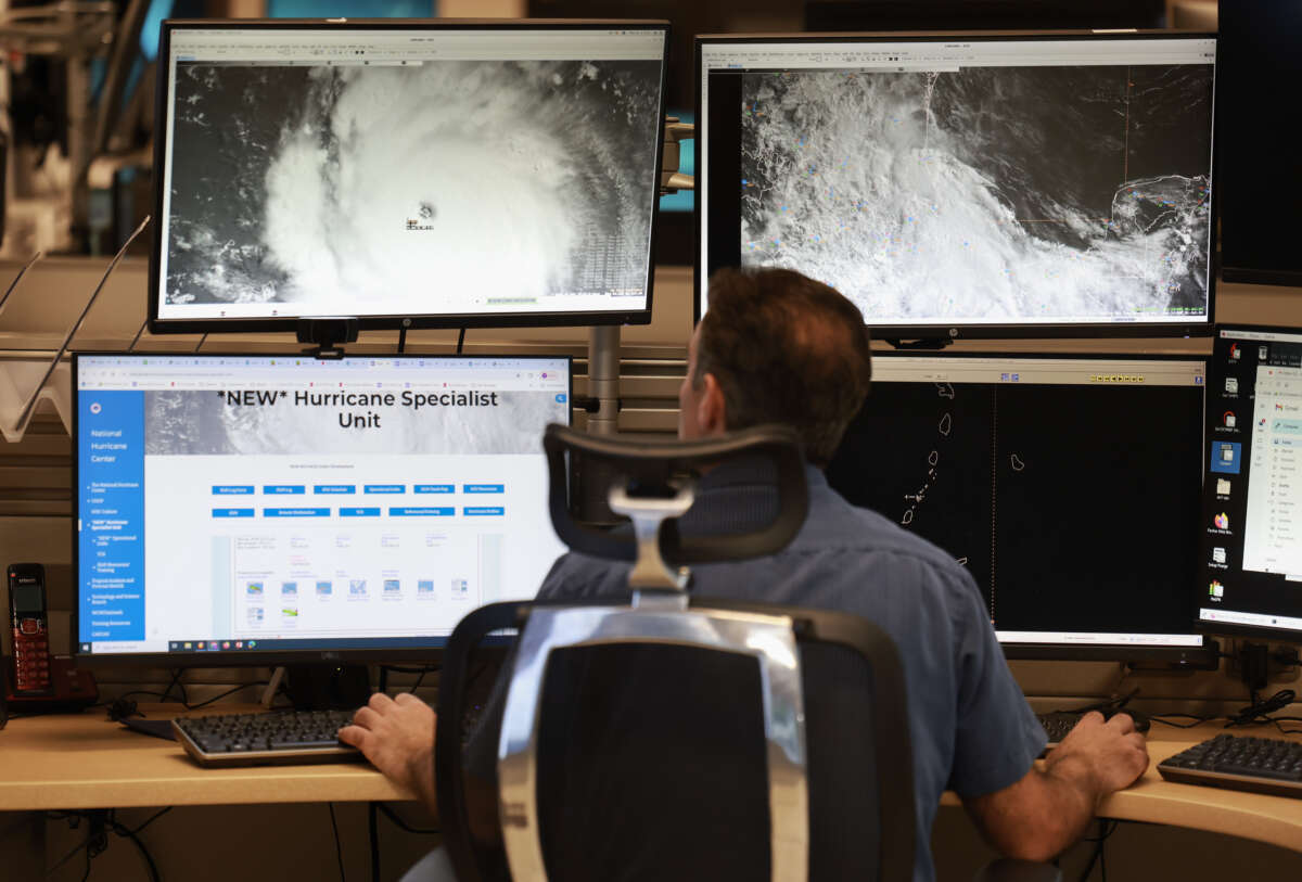 A hurricane specialist works on tracking Hurricane Beryl at the National Hurricane Center on July 1, 2024 in Miami, Florida.