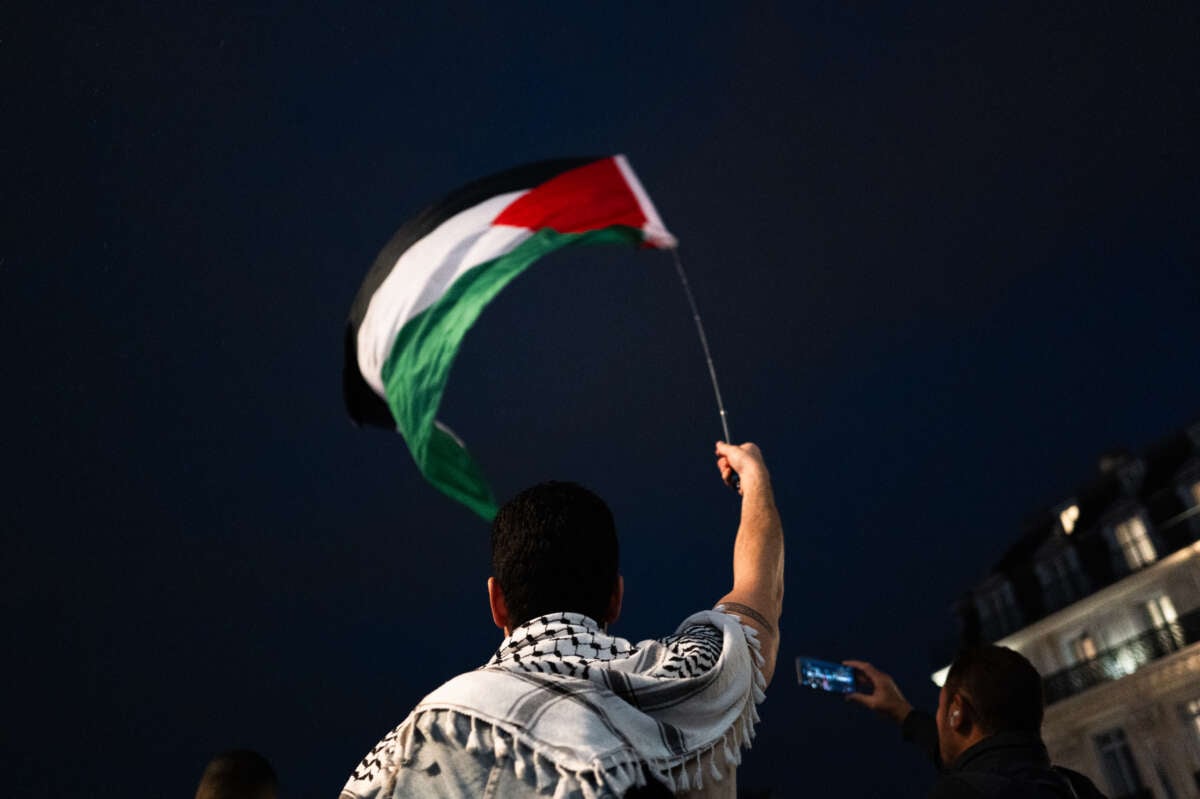 Protesters with flags attend a demonstration in support of Palestinian and Lebanese people as intense Israeli attacks occur in Gaza and Lebanon, in Paris, France, on October 25, 2024.