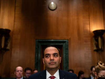 Consumer Financial Protection Bureau (CFPB) Director Rohit Chopra arrives to testify before a Senate Banking, Housing, and Urban Affairs Committee hearing on Capitol Hill on December 11, 2024, in Washington, D.C.