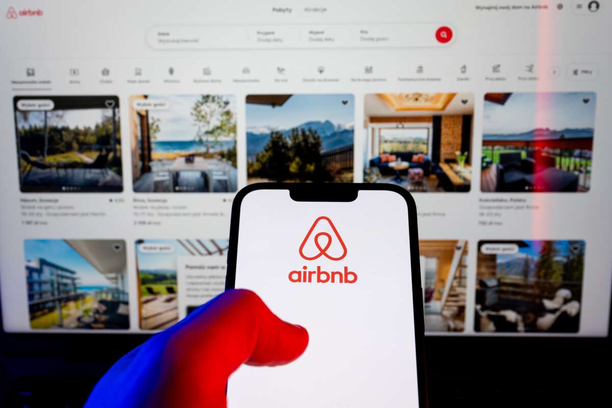 In this photo illustration, an Airbnb logo is displayed on a smartphone.