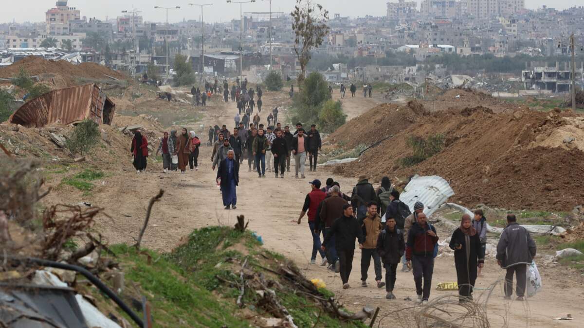 Displaced Palestinians cross the Netzarim Corridor as they make their way to the northern parts of the Gaza Strip on February 9, 2025.