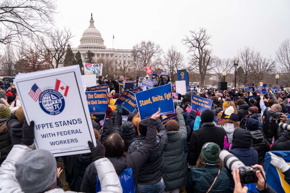 Protesters gather at a rally organized by the American Federation of Government Employees against the “Department of Government Efficiency” purges and resignation offers made to the federal civilian workforce outside the U.S. Capitol in Washington, D.C., on February 11, 2025.