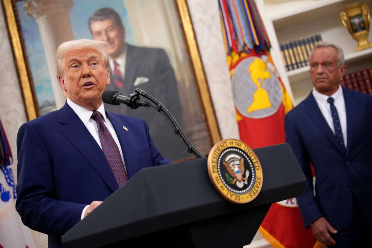 Donald Trump speaks alongside Robert F. Kennedy Jr. before Kennedy is sworn in as secretary of Health and Human Services in the Oval Office at the White House on February 13, 2025, in Washington, D.C.