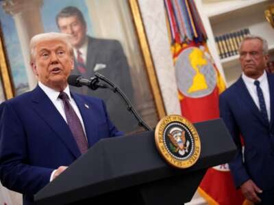 Donald Trump speaks alongside Robert F. Kennedy Jr. before Kennedy is sworn in as secretary of Health and Human Services in the Oval Office at the White House on February 13, 2025, in Washington, D.C.