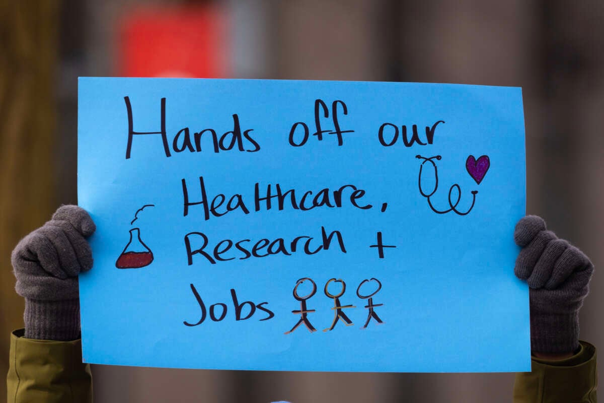 People including researchers from Chicago area universities gather on the University of Illinois Chicago (UIC) campus to voice concerns about the potential loss of federal funding for medical research on February 19, 2025, in Chicago, Illinois.