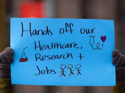 People including researchers from Chicago area universities gather on the University of Illinois Chicago (UIC) campus to voice concerns about the potential loss of federal funding for medical research on February 19, 2025, in Chicago, Illinois.