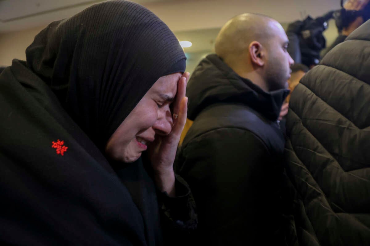 Palestinian families react after Israel delayed the release of Palestinian prisoners, scheduled to be released in the seventh hostage-prisoner exchange, in the occupied West Bank city of Ramallah, early on February 23, 2025.