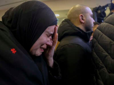 Palestinian families react after Israel delayed the release of Palestinian prisoners, scheduled to be released in the seventh hostage-prisoner exchange, in the occupied West Bank city of Ramallah, early on February 23, 2025.