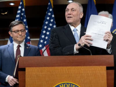 House Majority Leader Steve Scalise holds a copy of the House Republicans' budget bill during a press conference following the Republican Conference meeting, on Capitol Hill in Washington, D.C., on February 25, 2025.