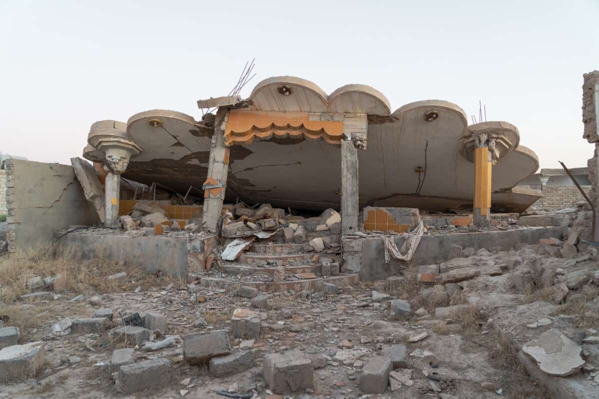 Ruined buildings are shown of a village in northern Sinjar, where Yazidi have recently begun to return. 