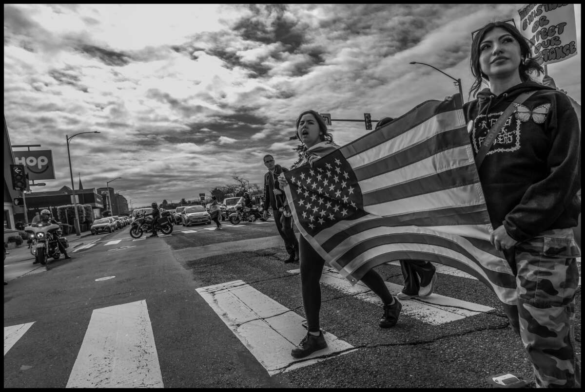 These photos capture protests against ICE and Trump’s threats of mass deportation in February 2025, in San Mateo and Fort Bragg, California.