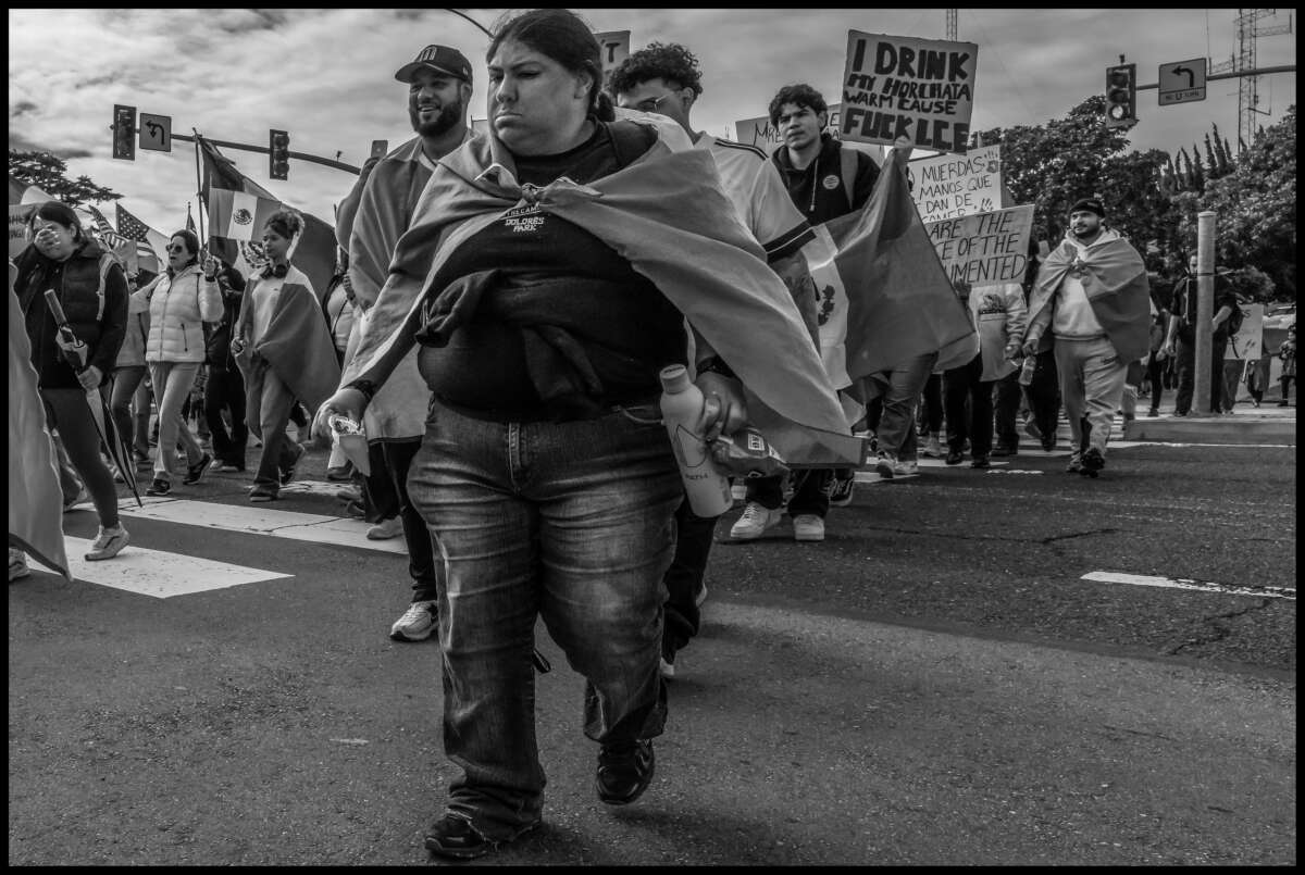 These photos capture protests against ICE and Trump’s threats of mass deportation in February 2025, in San Mateo and Fort Bragg, California.