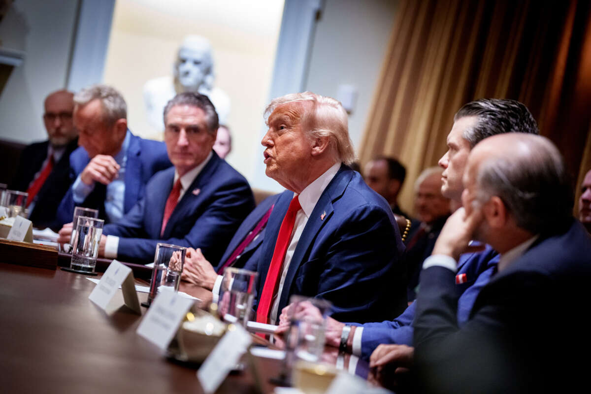 Trump admin sits at a table