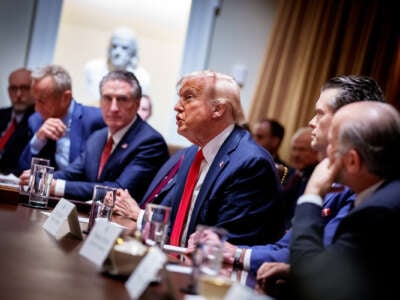 Trump admin sits at a table