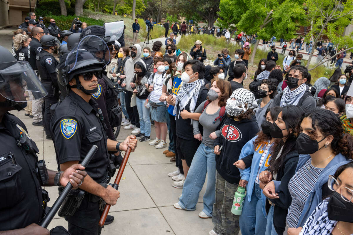 Pro-Palestinian protesters stand off with police during a rally on the campus of UCLA in Los Angeles on May 23, 2024.