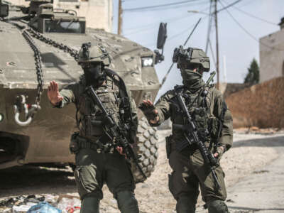 Israeli soldiers guard Eitan armored vehicles during a military operation in Nablus, Palestine, on March 4, 2025. The Israeli army killed two Palestinians in the eastern neighborhood of Jenin, using armored vehicles and drones in the operation, burned two houses, and destroyed another during the military operation.