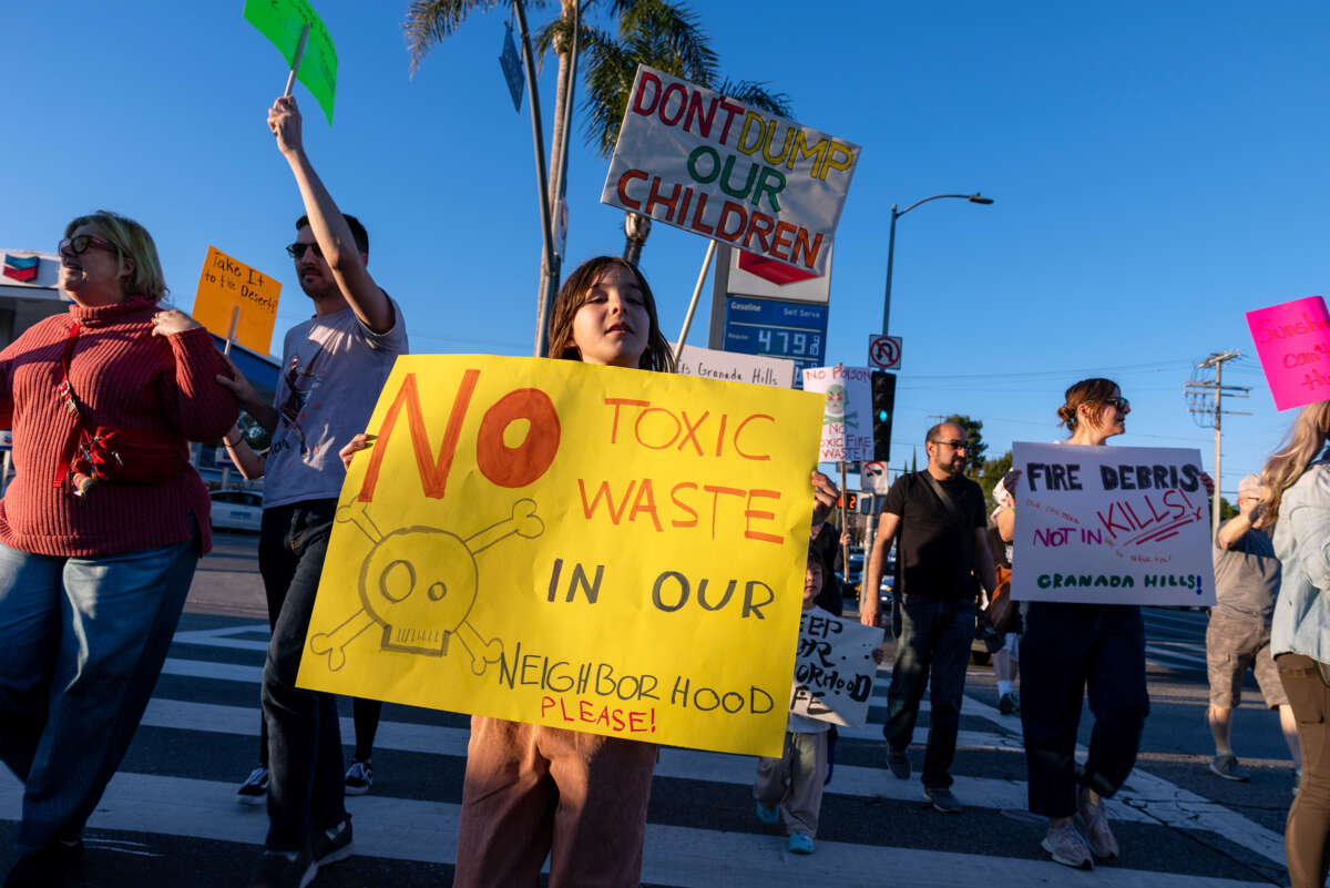 Demonstrators rally against the dumping of toxic debris from the ruins of thousands of buildings destroyed by January's historic wildfires into Sunshine Canyon Landfill and other local dump sites on February 24, 2025, in Los Angeles, California.