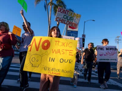 Demonstrators rally against the dumping of toxic debris from the ruins of thousands of buildings destroyed by January's historic wildfires into Sunshine Canyon Landfill and other local dump sites on February 24, 2025, in Los Angeles, California.