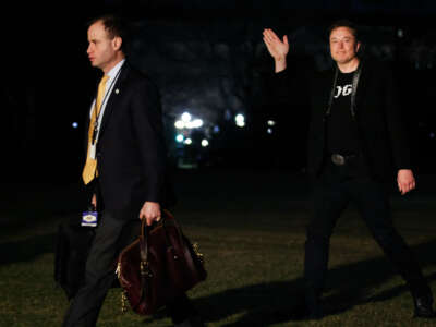 Staff Secretary Will Scharf (left) and White House Senior Advisor Elon Musk walk to the White House after landing in Marine One on the South Lawn on March 9, 2025, in Washington, D.C.