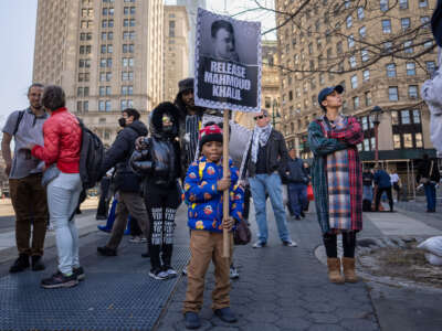 A child holds a sign calling the release of Mahmoud Khalil at Foley Square on March 10, 2025, in New York City.