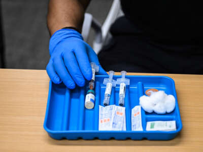 A health worker prepares a dose of the measles vaccine at a health center in Lubbock, Texas, on February 27, 2025.