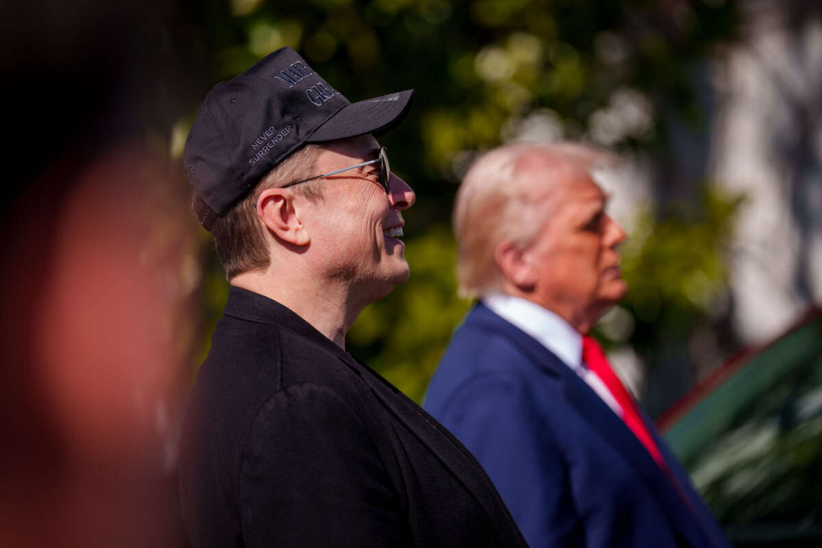 President Donald Trump and Elon Musk look at electric Tesla cars on the South Lawn of the White House on March 11, 2025, in Washington, D.C.